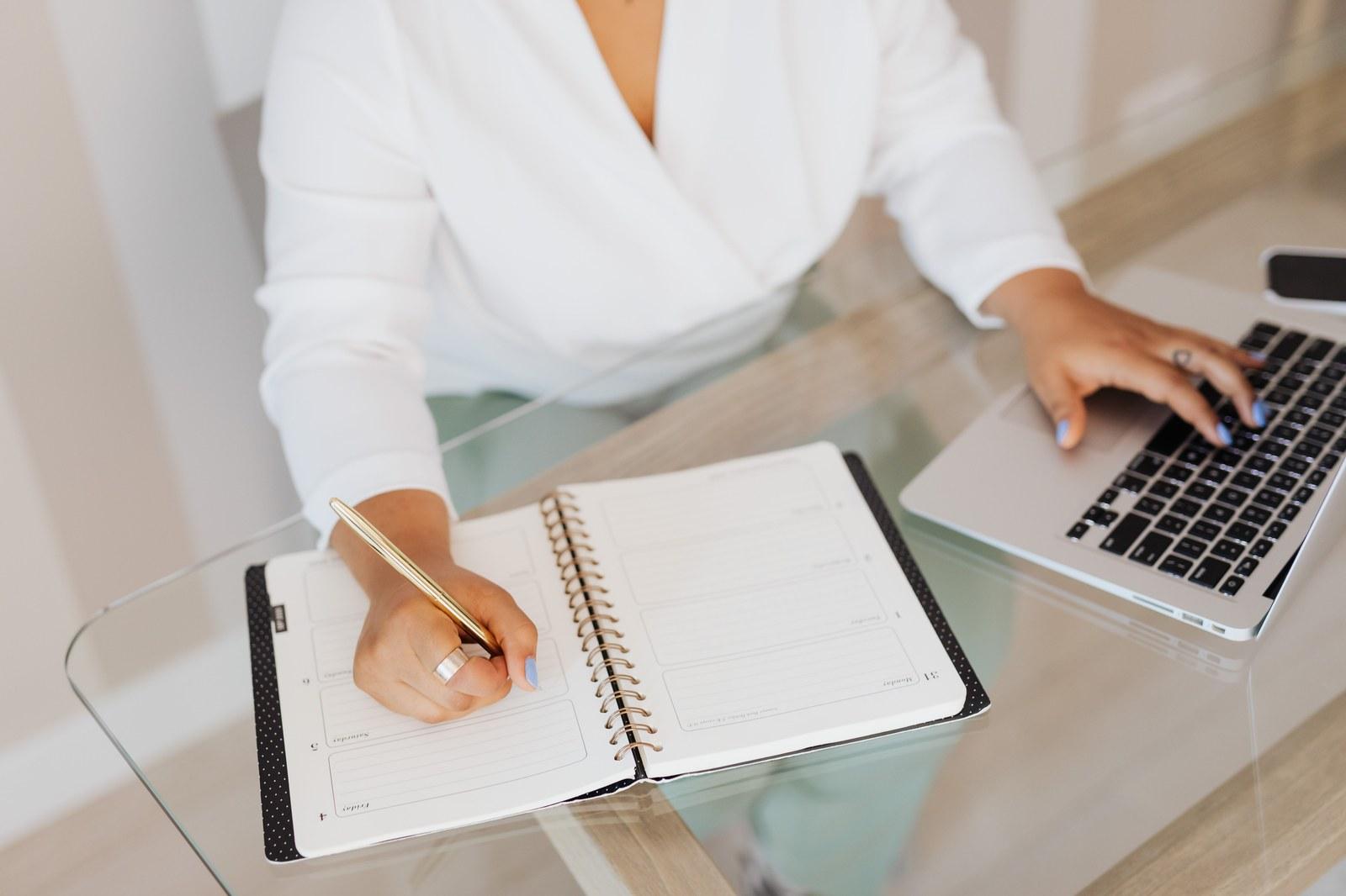Hands preparing notes and reviewing material at a desk, showing human judgement around a specific situation.
